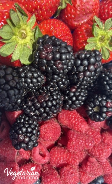 Close up of strawberries, blackberries, and raspberries.