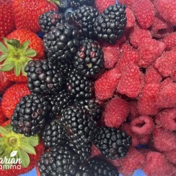 Strawberries, blackberries, raspberries, and blueberries in a 9x12in pan.