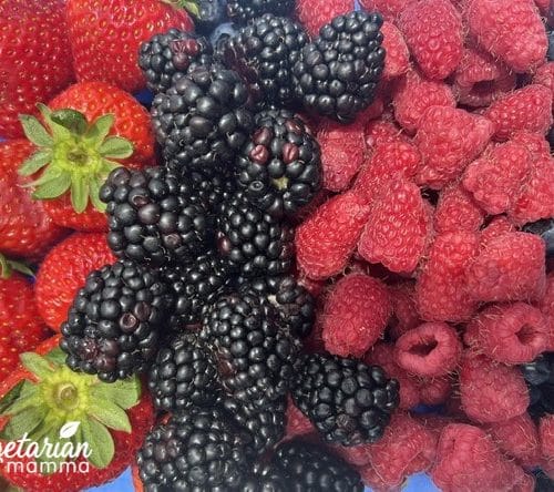 Strawberries, blackberries, raspberries, and blueberries in a 9x12in pan.